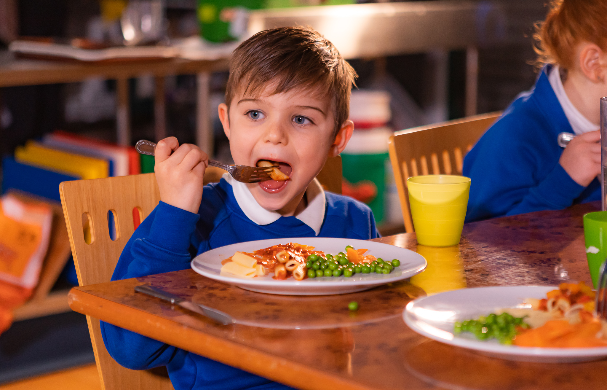 A chef frying food in a wok