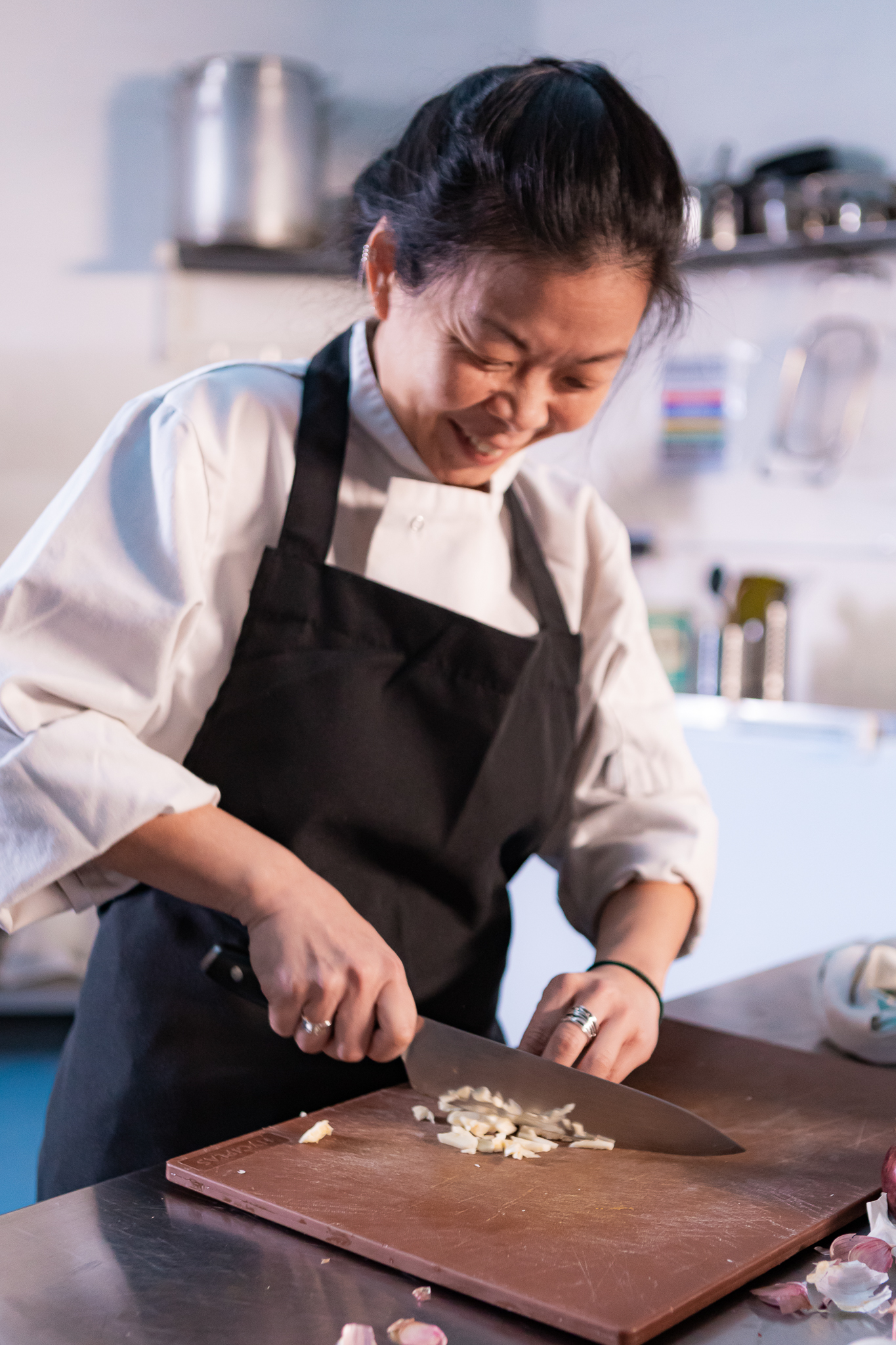 A chef frying food in a wok