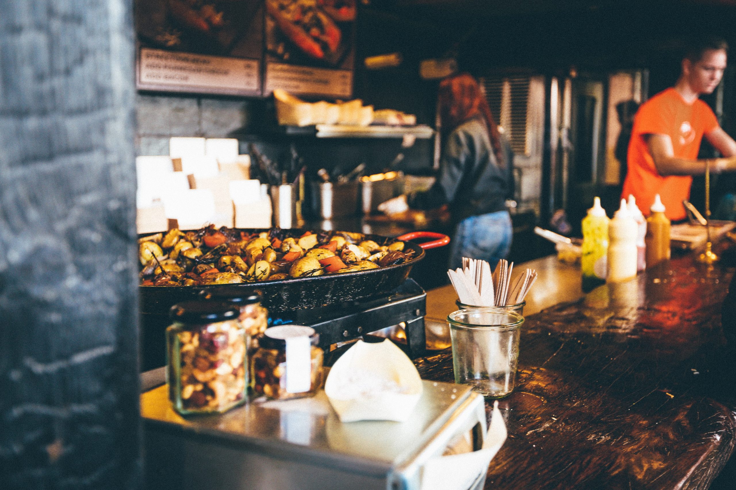 A chef frying food in a wok